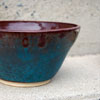 Photograph of a blue and red ceramic bowl